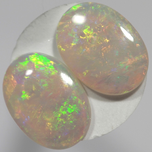 SOLID SEMI BLACK OPALS Matching pair, bright green and orange